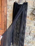 Gonna copricostume nera con dettagli in esposizione